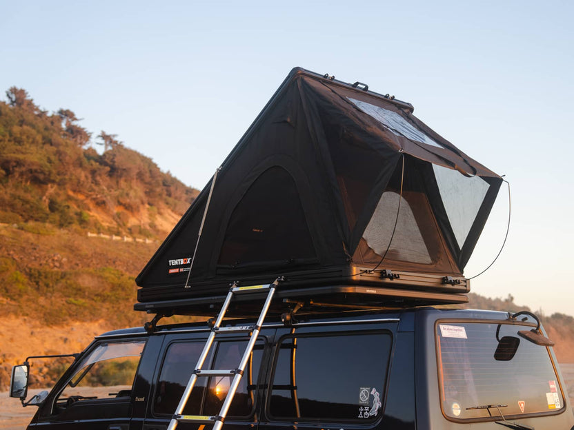 TentBox Cargo 2.0 in Midnight Grey colour install on a van at the beach