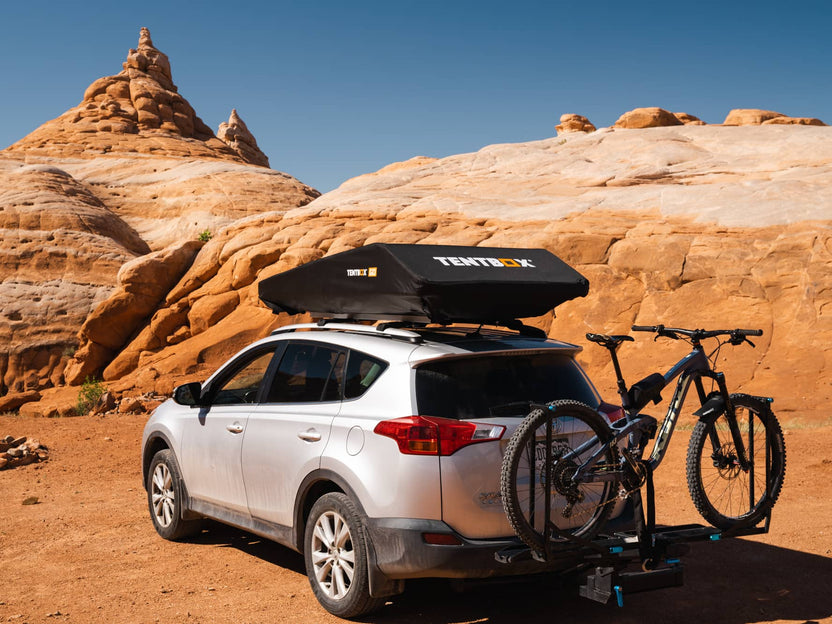 Closed view of the TentBox GO in Utah, mounted on a Toyota Rav4 with a mountain bike on the back