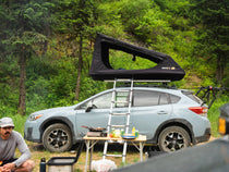 The TentBox GO installed on a Subaru family car in the forest