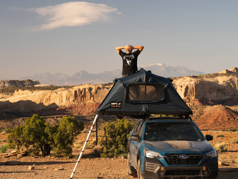 Man enjoying the Utah views whilst standing inside his TentBox Lite XL in Summer Mode.