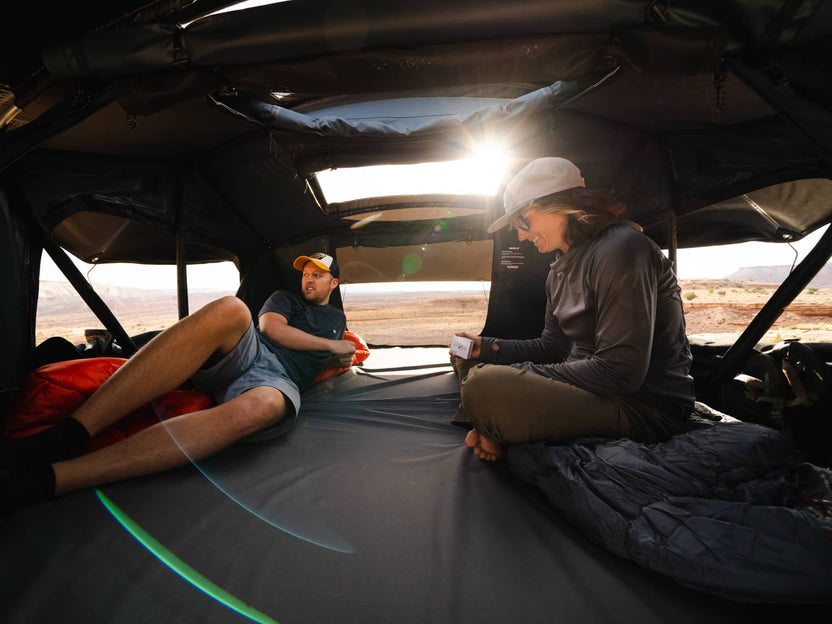Couple enjoying the spacious interiors of the TentBox Lite XL rooftop tent