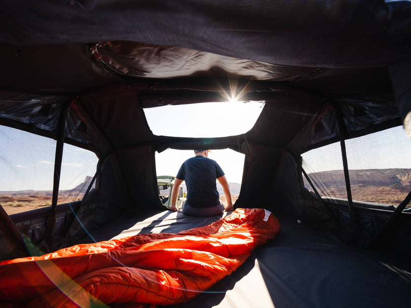 Enjoying the desert views from the edge of the TentBox Lite XL rooftop tent.