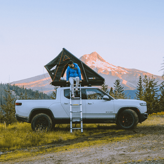 TentBox Cargo roof tent installed on Rivian truck in USA mountain camp site