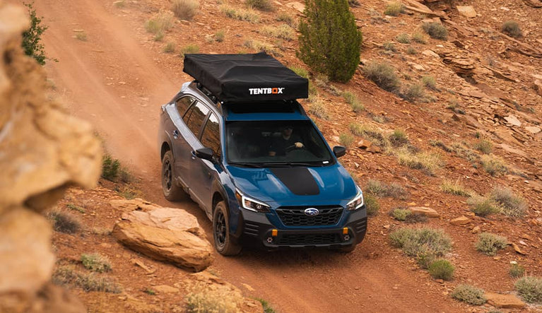 TentBox Lite XL installed on a Subaru Forester driving through the Utah desert