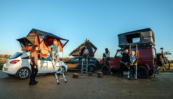Happy people camping with their TentBox roof tents